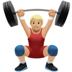 man lifting weights: medium-light skin tone لمنصة Apple