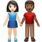 woman and man holding hands: light skin tone, medium-dark skin tone para a plataforma Apple