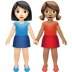 women holding hands: light skin tone, medium skin tone til Apple platform