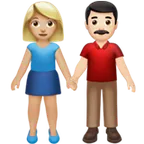 woman and man holding hands: medium-light skin tone, light skin tone for Apple platform