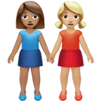 women holding hands: medium skin tone, medium-light skin tone for Apple platform