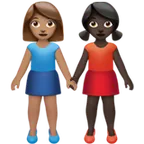 women holding hands: medium skin tone, dark skin tone for Apple platform