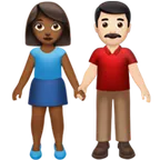 woman and man holding hands: medium-dark skin tone, light skin tone for Apple platform