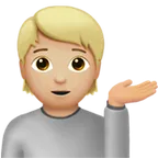 person tipping hand: medium-light skin tone untuk platform Apple