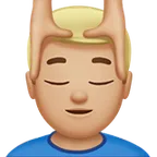 man getting massage: medium-light skin tone for Apple platform