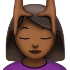 woman getting massage: medium-dark skin tone til Apple platform