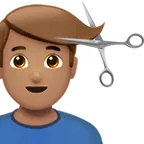 man getting haircut: medium skin tone لمنصة Apple