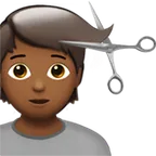person getting haircut: medium-dark skin tone untuk platform Apple