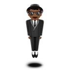 Apple dla platformy person in suit levitating: medium-dark skin tone