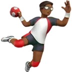 man playing handball: medium-dark skin tone for Apple platform