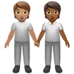 people holding hands: medium skin tone, medium-dark skin tone per la piattaforma Apple