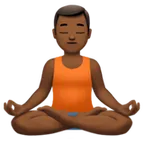 man in lotus position: medium-dark skin tone for Apple platform