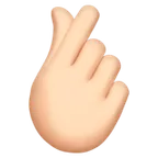 hand with index finger and thumb crossed: light skin tone per la piattaforma Apple