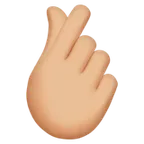 hand with index finger and thumb crossed: medium-light skin tone per la piattaforma Apple