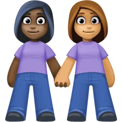 women holding hands: dark skin tone, medium skin tone for Facebook platform