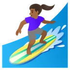 woman surfing: medium-dark skin tone สำหรับแพลตฟอร์ม Google
