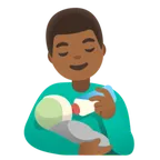 man feeding baby: medium-dark skin tone สำหรับแพลตฟอร์ม Google