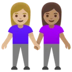 women holding hands: medium-light skin tone, medium skin tone for Google platform