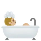 person taking bath: medium-light skin tone untuk platform Google