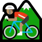 person mountain biking: medium skin tone untuk platform Microsoft