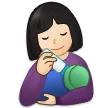woman feeding baby: light skin tone لمنصة Samsung