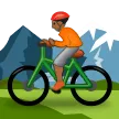 person mountain biking: medium-dark skin tone สำหรับแพลตฟอร์ม Samsung