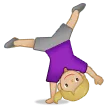 woman cartwheeling: medium-light skin tone for Samsung platform