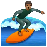 man surfing: medium-dark skin tone for Whatsapp platform