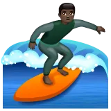 man surfing: dark skin tone for Whatsapp platform