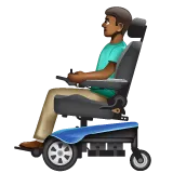 man in motorized wheelchair: medium-dark skin tone สำหรับแพลตฟอร์ม Whatsapp