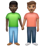 men holding hands: dark skin tone, medium skin tone per la piattaforma Whatsapp