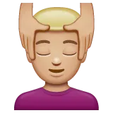 man getting massage: medium-light skin tone for Whatsapp platform
