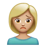 woman frowning: medium-light skin tone pour la plateforme Whatsapp