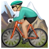 person mountain biking: medium-light skin tone สำหรับแพลตฟอร์ม Whatsapp