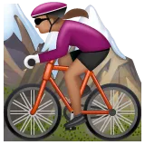 woman mountain biking: medium skin tone til Whatsapp platform