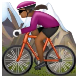 woman mountain biking: medium-dark skin tone لمنصة Whatsapp