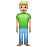 man standing: medium-light skin tone voor Whatsapp platform