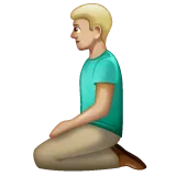 man kneeling: medium-light skin tone for Whatsapp platform