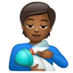person feeding baby: medium-dark skin tone สำหรับแพลตฟอร์ม Whatsapp